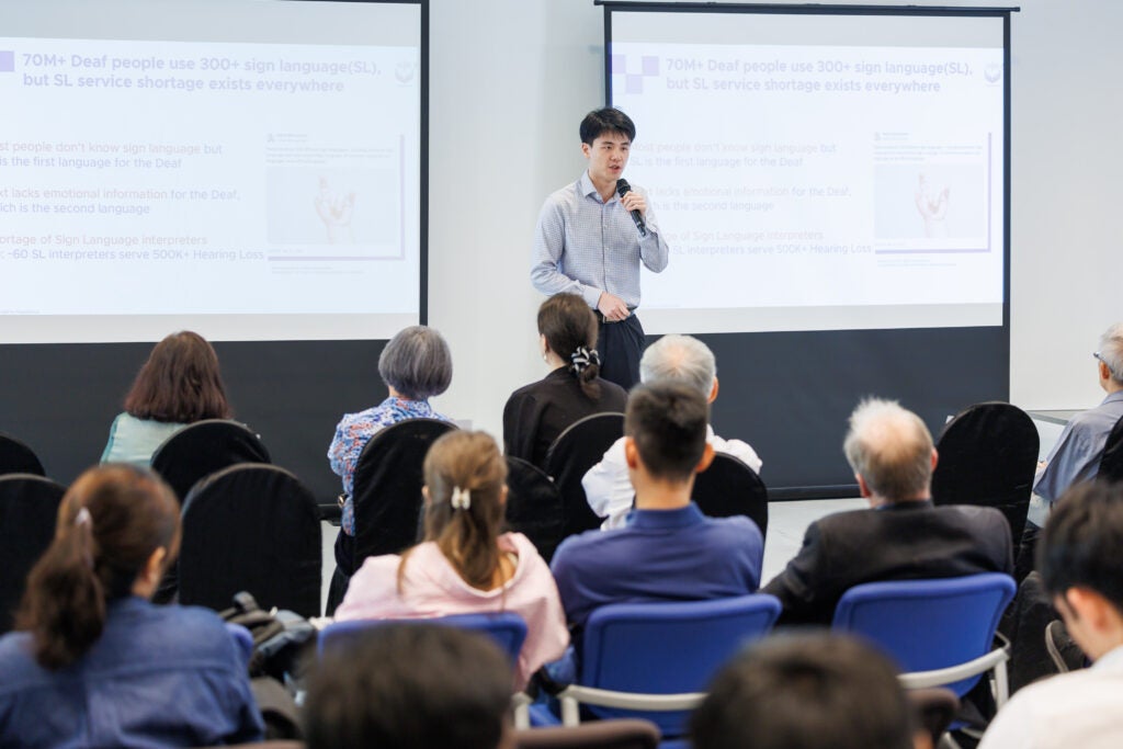 Gong He delivering his pitch at the TS2 Demo Day in July 2024